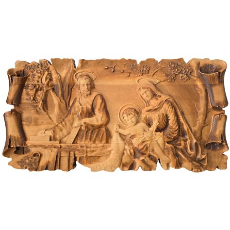 Tematická fotografia dreveného betlehemu s detailom Svätej rodiny