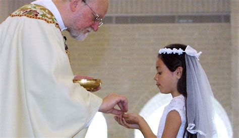 Children receiving First Holy Communion in a church