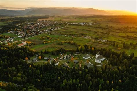 Panoramic view of the Liptov region with thermal pools and surrounding mountains.