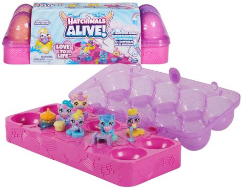 obrázok rozloženého vianočného kalendára Hatchimals s otvorenými priehradkami a rozprávkovou zimnou scénou