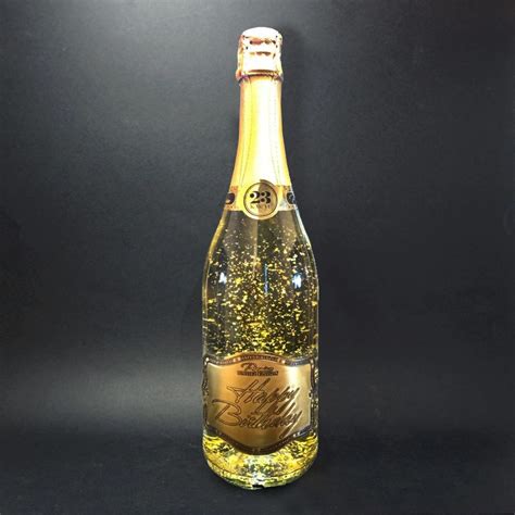 Fľaša šumivého vína Gold Cuvee so zlatými lupienkami a personalizovaným venovaním