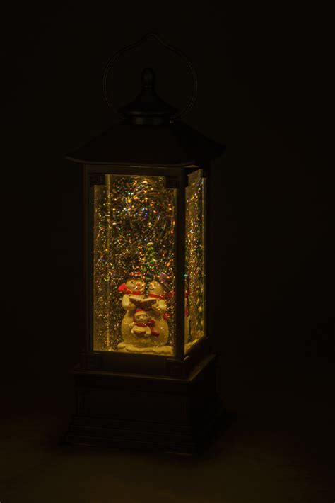 Vysoký vianočný stojanový lampáš s efektom padajúceho snehu a Santa Clausom