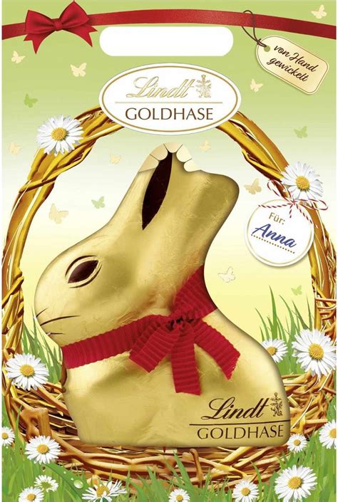 Obrázok Lindt Zlatého zajačika s charakteristickou zlatou fóliou a červenou stužkou so zvončekom.