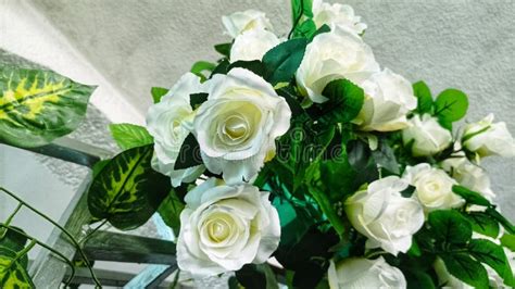 Close-up photo of artificial white roses used in car decoration