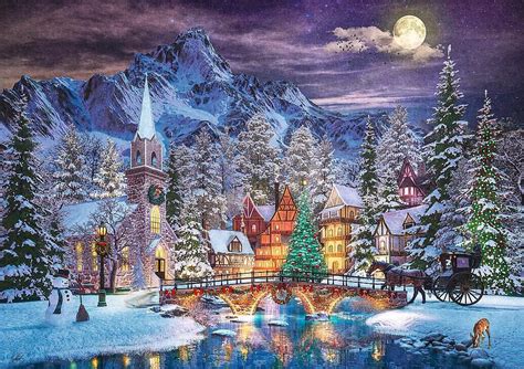 Vianočná atmosféra so zasneženou krajinou a osvetleným domom