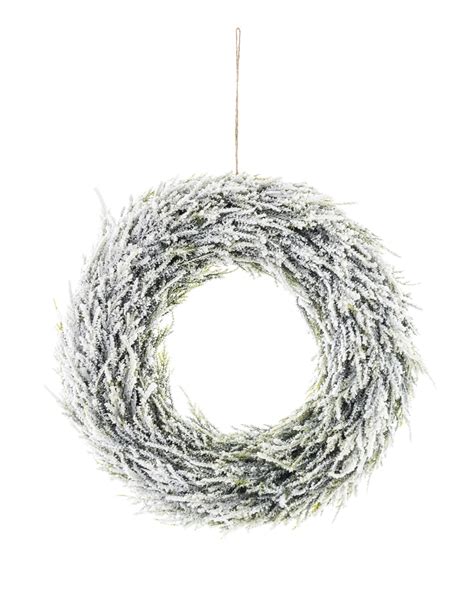 Zasnežený vianočný veniec z čečiny ako stredobod vianočnej výzdoby na dverách alebo stole