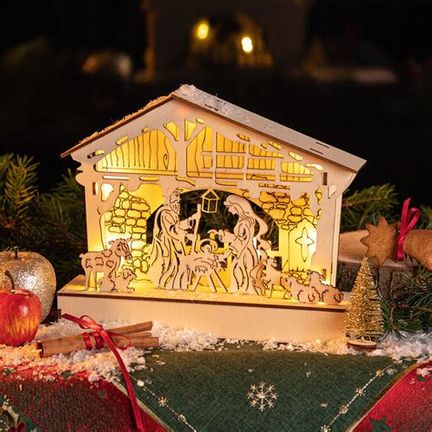 Ilustrácia rôznych typov vianočných betlehemov: drevený, svietiaci, v knihe, v sklenenej kupole.