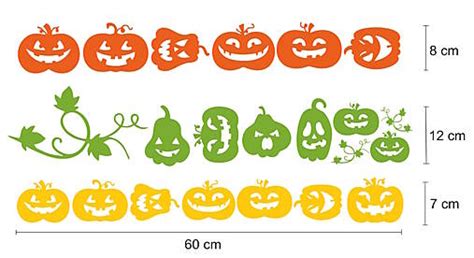 vytlačené halloweenske dekorácie na okne (tekvice, netopiere)