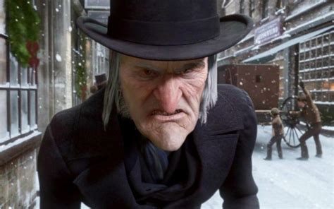Tematické foto: usmievavý Ebenezer Scrooge po premene, rozdáva vianočné dary