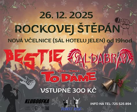 Koncert rockovej kapely s davom fanúšikov a gitaristom v akcii