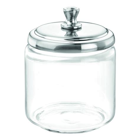 Sklenená dóza s nakladaným syrom a bylinkami.