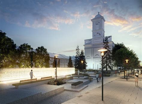 Atmosférická fotografia zasneženého Námestia sv. Egídia v Poprade s bohatou vianočnou výzdobou a vysvieteným vianočným stromčekom