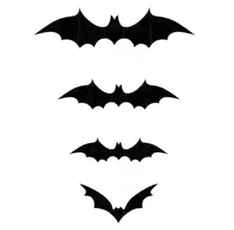 obrázok papierových netopierov rôznych veľkostí prilepených na stene