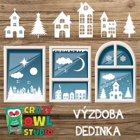 Zimná scéna na okne vytvorená z detailných papierových vystrihovačiek