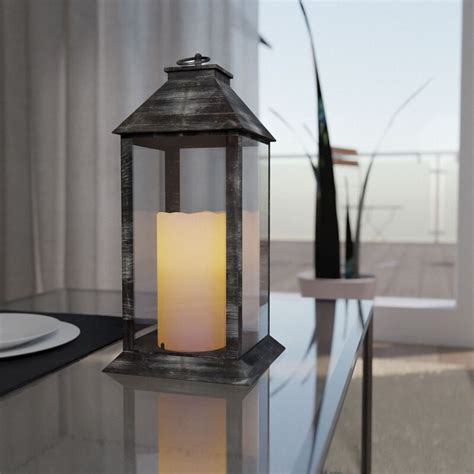 Čierny a biely LED lampáš s realistickou imitáciou plápolajúcej sviečky
