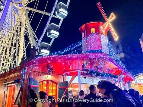 Christmas market stalls in Tuileries Gardens with the Ferris wheel in the background