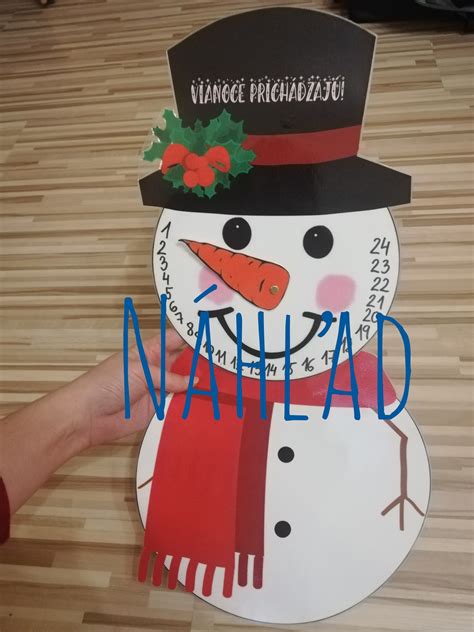 ilustrácia tlačeného adventného kalendára v tvare snehuliaka s pohyblivým nosom