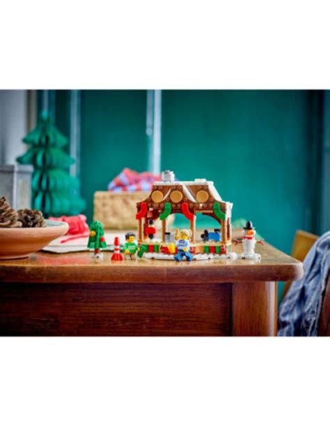 Ilustrácia detského kútika s montessori hračkami na vianočnom trhu