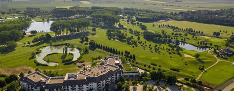 Thematic photo of Greenfield Hotel Golf & Spa exterior with golf course