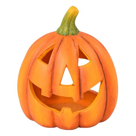 Osvetlená halloweenska tekvica s vyrezanou tvárou